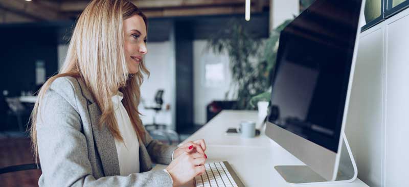 woman reading her survey participation thank you email